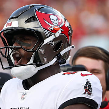 Sep 8, 2024; Tampa, Florida, USA; Tampa Bay Buccaneers wide receiver Jalen McMillan (15) and wide receiver Chris Godwin (14) celebrate a touchdown against the Washington Commanders in the third quarter  at Raymond James Stadium. Mandatory Credit: Nathan Ray Seebeck-Imagn Images