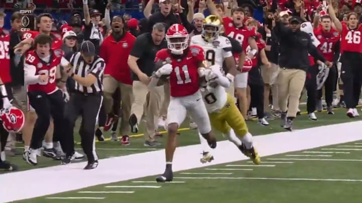 Georgia's Parker Jones collides with an official during the Sugar Bowl.