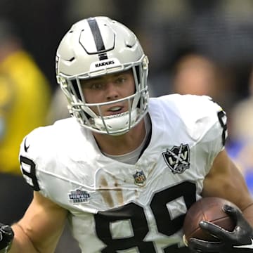 Sep 8, 2024; Inglewood, California, USA; Las Vegas Raiders tight end Brock Bowers (89) runs for a first down before he is stopped by Los Angeles Chargers cornerback Kristian Fulton (7) in the first half at SoFi Stadium. Mandatory Credit: Jayne Kamin-Oncea-Imagn Images