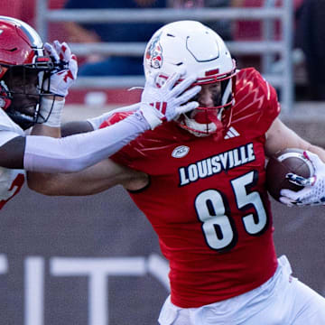 Louisville Cardinals tight end Nate Kurisky (85) pushes Jacksonville State Gamecocks cornerback Kenney Solomon II (3) off as he runs down the field during their game on Saturday, Sept. 7, 2024 at L&N Federal Credit Union Stadium in Louisville, Ky.