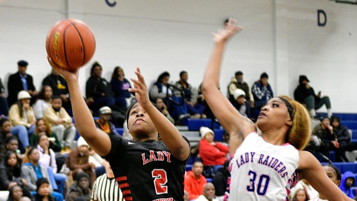 Ja'kiyah Redman (right) and the Huntington Raiders take on John Curtis on Thursday.
