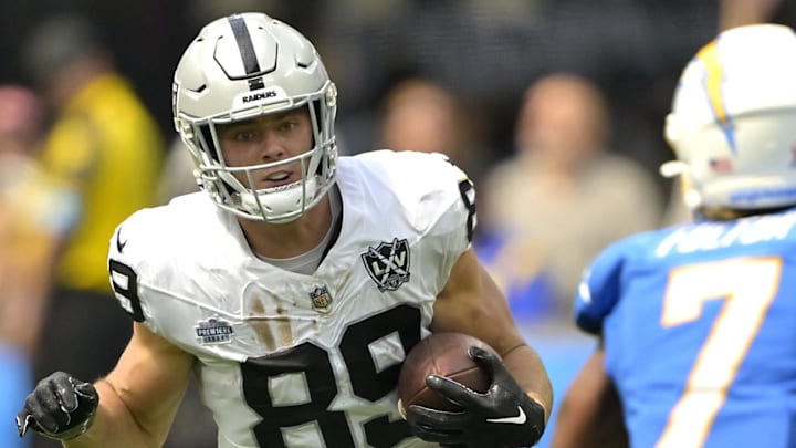 Sep 8, 2024; Inglewood, California, USA; Las Vegas Raiders tight end Brock Bowers (89) runs for a first down before he is stopped by Los Angeles Chargers cornerback Kristian Fulton (7) in the first half at SoFi Stadium. Mandatory Credit: Jayne Kamin-Oncea-Imagn Images