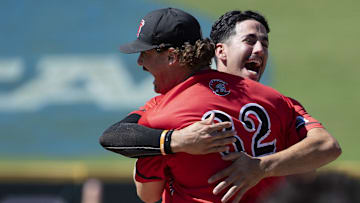 University of Tampa's Anthony Nunez (9) and J.P. Gates (32) hug after winning the DII Baseball Men's College World Series at USA Baseball National Training Complex in Cary, NC in 2024.