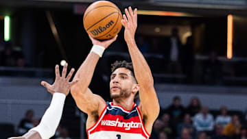 Apr 8, 2025; Indianapolis, Indiana, USA; Washington Wizards guard Colby Jones (1) shoots the ball while Indiana Pacers guard Bennedict Mathurin (00) defends in the second half at Gainbridge Fieldhouse. Mandatory Credit: Trevor Ruszkowski-Imagn Images