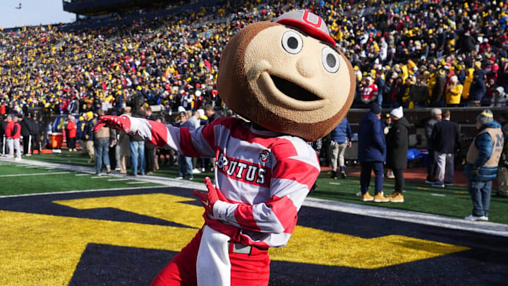 Nov 25, 2023; Ann Arbor, Michigan, USA; Ohio State Buckeyes mascot Brutus Buckeye cheers prior to the NCAA football game against the Michigan Wolverines at Michigan Stadium. Nov 25, 2023; Ann Arbor, Michigan, USA; Ohio State Buckeyes mascot Brutus Buckeye cheers prior to the NCAA football game against the Michigan Wolverines at Michigan Stadium.