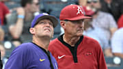Arkansas Razorbacks coach Dave Van Horn, right, finds his team in the loser's bracket for today's 1 p.m. game while LSU Tigers coach Jay Johnson is looking confidently toward tonight's 6 p.m. game against UCLA.