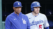Sep 10, 2023; Washington, District of Columbia, USA; Los Angeles Dodgers manager Dave Roberts (30) and Dodgers first baseman Freddie Freeman (5) look on from the dugout durining the eighth inning against the Washington Nationals at Nationals Park. Mandatory Credit: Amber Searls-Imagn Images