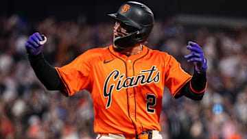 Jul 11, 2025; San Francisco, California, USA; San Francisco Giants shortstop Willy Adames (2) celebrates on base after hitting a two run triple against the Los Angeles Dodgers during the fifth inning at Oracle Park
