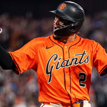 Jul 11, 2025; San Francisco, California, USA; San Francisco Giants shortstop Willy Adames (2) celebrates on base after hitting a two run triple against the Los Angeles Dodgers during the fifth inning at Oracle Park