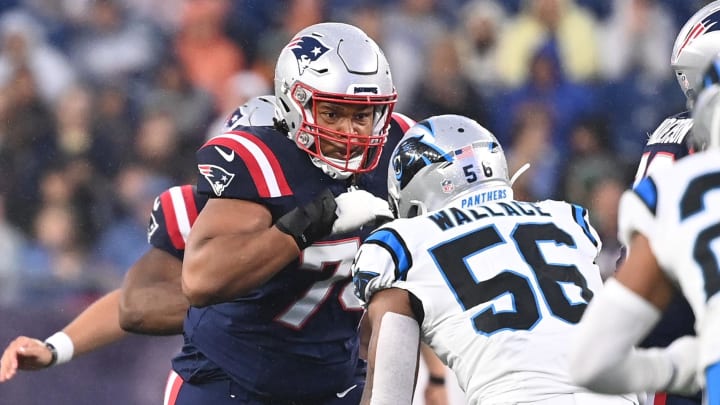 August 8, 2024; Foxborough, MA, USA;  New England Patriots guard Michael Jordan (74) blocks Carolina Panthers linebacker Trevin Wallace (56) during the first half at Gillette Stadium. 