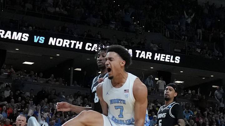 Mar 19, 2026; Greenville, SC, USA; North Carolina Tar Heels guard Seth Trimble (7) celebrates after dunking the ball past VCU Rams forward Michael Belle (8) in the first half of a first round game of the men's 2026 NCAA Tournament at Bon Secours Wellness Arena. Mandatory Credit: Jim Dedmon-Imagn Images