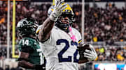Michigan running back Justice Haynes (22) runs for a touchdown against Michigan State 