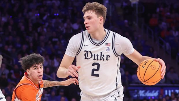 Duke Blue Devils guard Cooper Flagg drives past Illinois guard Will Riley