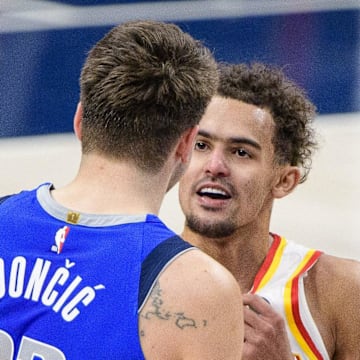 Feb 10, 2021; Dallas, Texas, USA; Dallas Mavericks guard Luka Doncic (77) talks with Atlanta Hawks guard Trae Young (11) after the game at the American Airlines Center. Mandatory Credit: Jerome Miron-Imagn Images