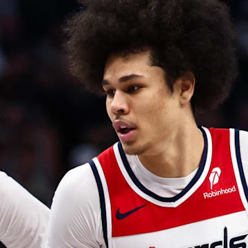 Washington Wizards forward Kyshawn George drives to the basket as Dallas Mavericks forward Cooper Flagg defends.