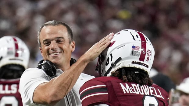 Shane Beamer congratulates JuJu McDowell on his touchdown