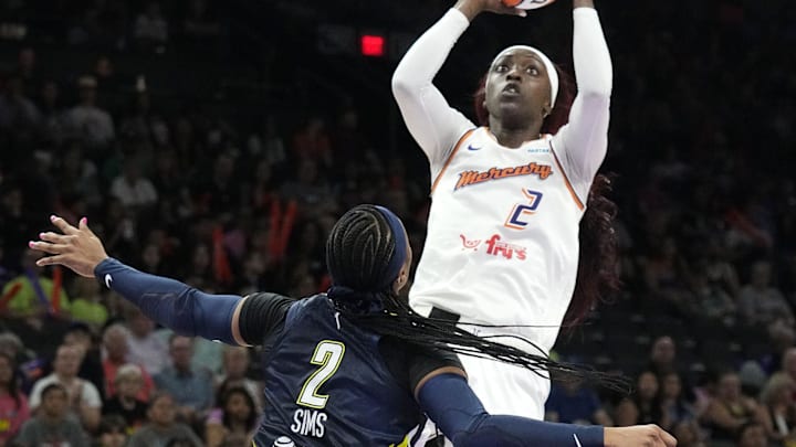 Phoenix Mercury guard Kahleah Copper (2) shoots a jumper over Dallas Wings guard Odyssey Sims (2) in the first half at Footprint Center in Phoenix on July 10, 2024.