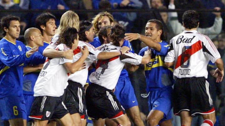 Players of Boca Juniors and River Plate