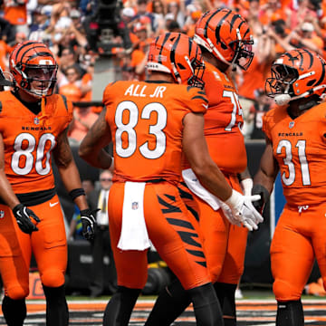 Cincinnati Bengals halfback Zack Moss (31) celebrates his touchdown in the 3rd quarter with teammates Cincinnati Bengals tight end Erick All Jr. (83) during their home opener against the New England Patriots at Paycor Stadium Sunday, September 8, 2024.