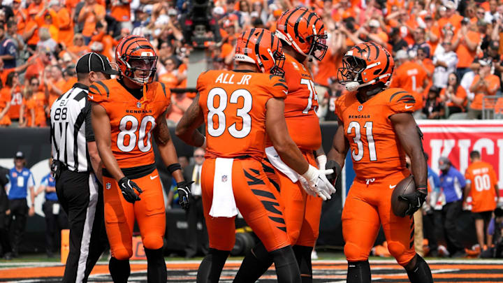 Cincinnati Bengals halfback Zack Moss (31) celebrates his touchdown in the 3rd quarter with teammates Cincinnati Bengals tight end Erick All Jr. (83) during their home opener against the New England Patriots at Paycor Stadium Sunday, September 8, 2024.