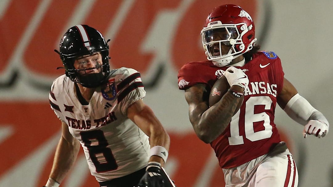 Arkansas Razorbacks defensive back Miguel Mitchell (16) returns an interception during the forth quarter against the Texas Tech Red Raiders at Simmons Bank Liberty Stadium. 