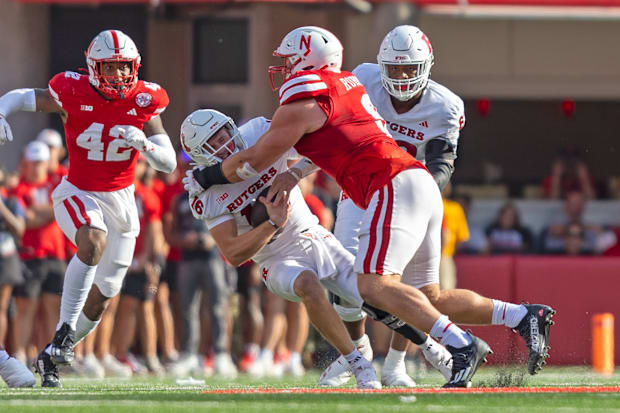 Nebraska defensive lineman Ty Robinson sacks Rutgers quarterback Athan Kaliakmanis for a 9-yard loss.
