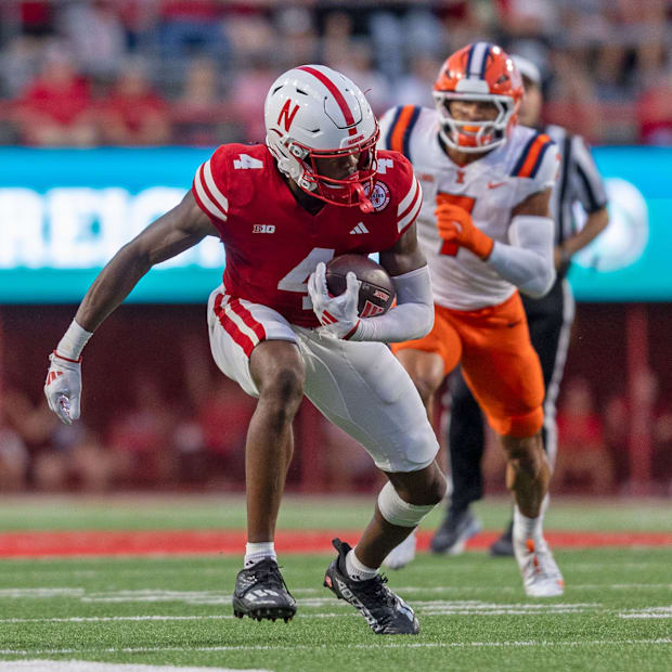 Nebraska wide receiver Jahmal Banks gains 12 yards on a pass from quarterback Dylan Raiola against Illinois.