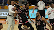 Houston players celebrate after the Cougars rally late to down Duke, 70-67, in the NCAA Final Four on April 5, 2025