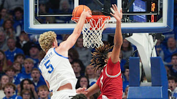 Kentucky Wildcats guard Collin Chandler (5) dunks over Nicholls Colonels forward Grant Sanders (7) in the second half at Rupp Arena in Lexington, Kentucky Nov. 4, 2025.
