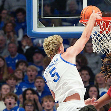 Kentucky Wildcats guard Collin Chandler (5) dunks over Nicholls Colonels forward Grant Sanders (7) in the second half at Rupp Arena in Lexington, Kentucky Nov. 4, 2025.