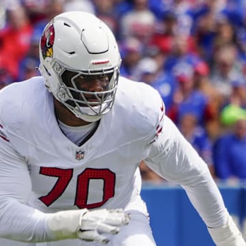 Sep 8, 2024; Orchard Park, New York, USA; Arizona Cardinals offensive tackle Paris Johnson Jr. (70) looks to block against the Buffalo Bills during the first half at Highmark Stadium. Mandatory Credit: Gregory Fisher-Imagn Images