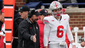 Nov 25, 2023; Ann Arbor, Michigan, USA; Ohio State Buckeyes head coach Ryan Day talks to quarterback Kyle McCord (6) on the sideline during the second half of the NCAA football game against the Michigan Wolverines at Michigan Stadium. Ohio State lost 30-24.