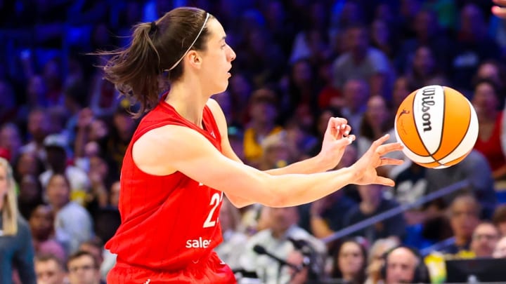 Jul 17, 2024; Arlington, Texas, USA;  Indiana Fever guard Caitlin Clark (22) passes the ball during the second half against the Dallas Wings at College Park Center. Mandatory Credit: Kevin Jairaj-USA TODAY Sports