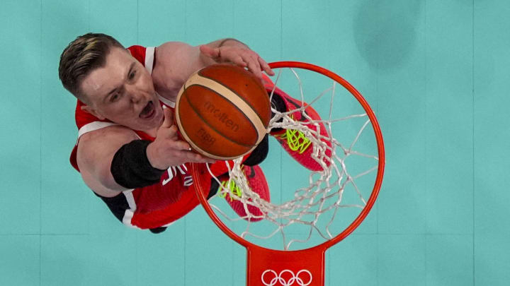 Jul 27, 2024; Villeneuve-d'Ascq, France; Japan centre Josh Hawkinson (24) goes up at the net during the Paris 2024 Olympic Summer Games at Stade Pierre-Mauroy. Mandatory Credit: John David Mercer-USA TODAY Sports