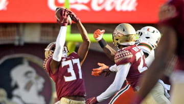 Nov 13, 2021; Tallahassee, Florida, USA; Florida State Seminoles defensive back Omarion Cooper (37) intercepts the ball during the first quarter against the Miami Hurricanes at Doak S. Campbell Stadium. Mandatory Credit: Melina Myers-USA TODAY Sports