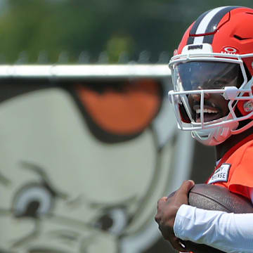Cleveland Browns quarterback Shedeur Sanders celebrates after breaking away for a big gain during practice.