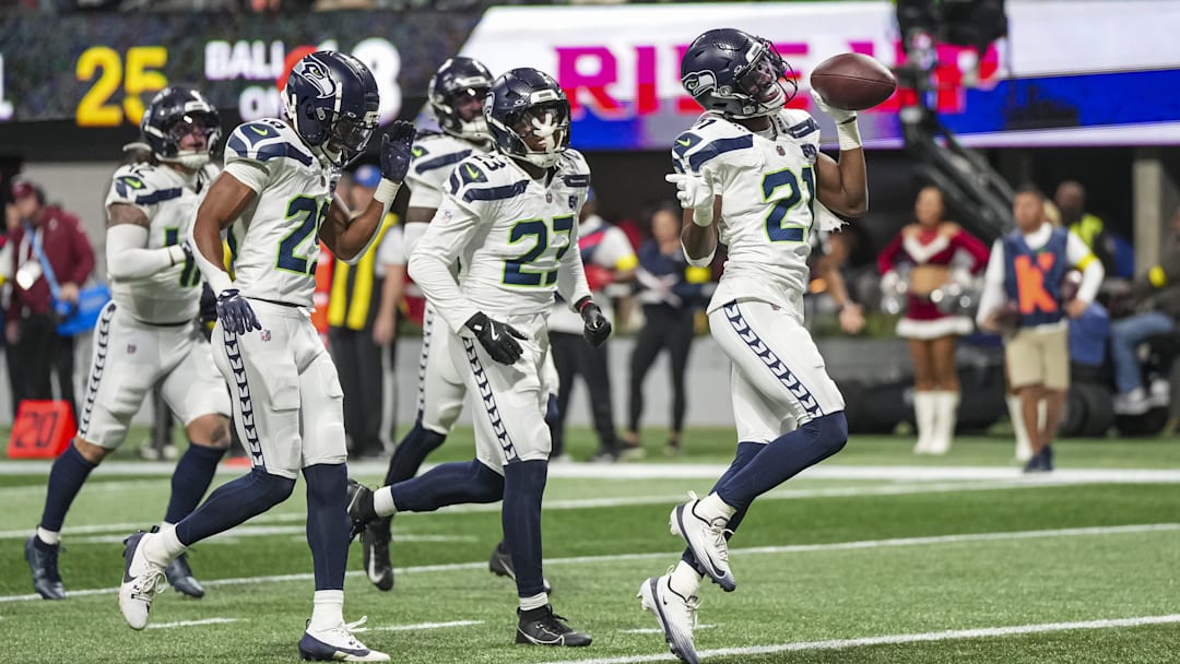 Dec 7, 2025; Atlanta, Georgia, USA; Seattle Seahawks cornerback Devon Witherspoon (21) reacts after recovering a fumble against the Atlanta Falcons during the second half at Mercedes-Benz Stadium. 