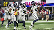 Dec 7, 2025; Atlanta, Georgia, USA; Seattle Seahawks cornerback Devon Witherspoon (21) reacts after recovering a fumble against the Atlanta Falcons during the second half at Mercedes-Benz Stadium. 