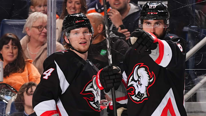 Buffalo Sabres players Bowen Byram and Alex Tuch