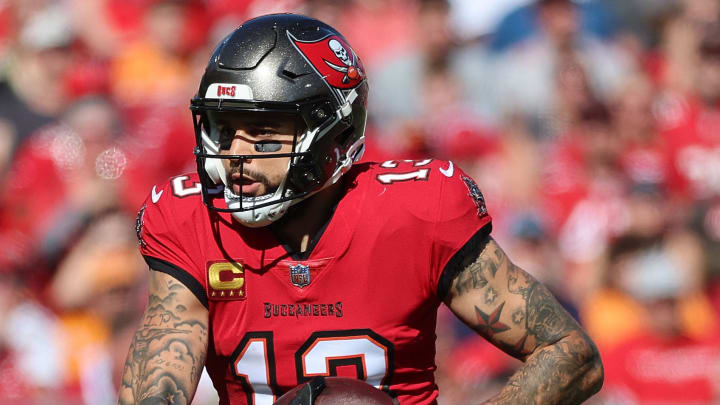 Dec 31, 2023; Tampa, Florida, USA; Tampa Bay Buccaneers wide receiver Mike Evans (13) runs with the ball against the New Orleans Saints during the first half at Raymond James Stadium. Mandatory Credit: Kim Klement Neitzel-USA TODAY Sports