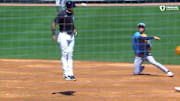 Javy Baez takes a throw off the helmet as the Detroit Tigers face the Tampa Bay Rays in spring training.