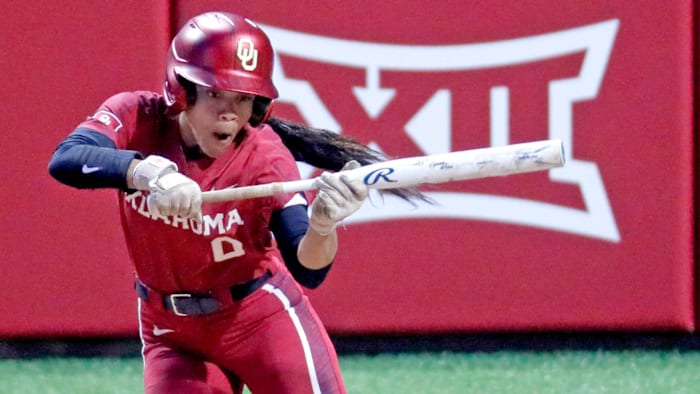 Oklahoma's Rylie Boone (0) bunts during the college softball game between the University of Oklahoma