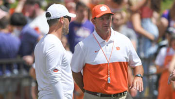 April 15, 2023; Clemson, SC , USA;  Clemson offensive coordinator Garrett Riley and head coach Dabo Swinney during the first quarter the annual Orange and White Spring game at Memorial Stadium in Clemson, S.C. Saturday, April 15, 2023.   Mandatory Credit: Ken Ruinard-USA TODAY NETWORK
