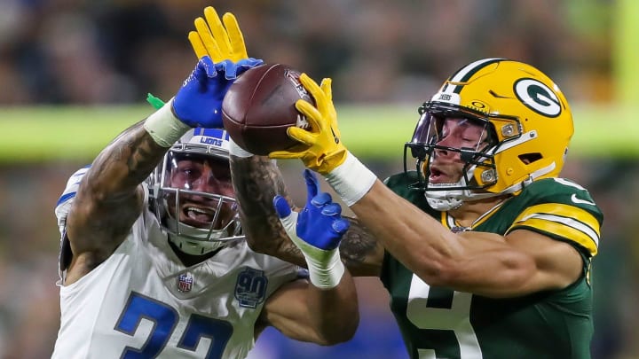 Detroit Lions safety Brian Branch (32) breaks up a pass intended for Green Bay Packers wide receiver Christian Watson (9) during their football game on Thursday, September 28, 2023, at Lambeau Field in Green Bay, Wis. 
Tork Mason/USA TODAY NETWORK-Wisconsin