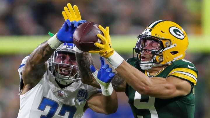 Detroit Lions safety Brian Branch (32) breaks up a pass intended for Green Bay Packers wide receiver Christian Watson (9) during their football game on Thursday, September 28, 2023, at Lambeau Field in Green Bay, Wis. 
Tork Mason/USA TODAY NETWORK-Wisconsin