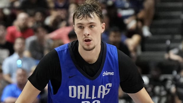 Dallas Mavericks forward Cooper Flagg dribbles against San Antonio Spurs forward Carter Bryant