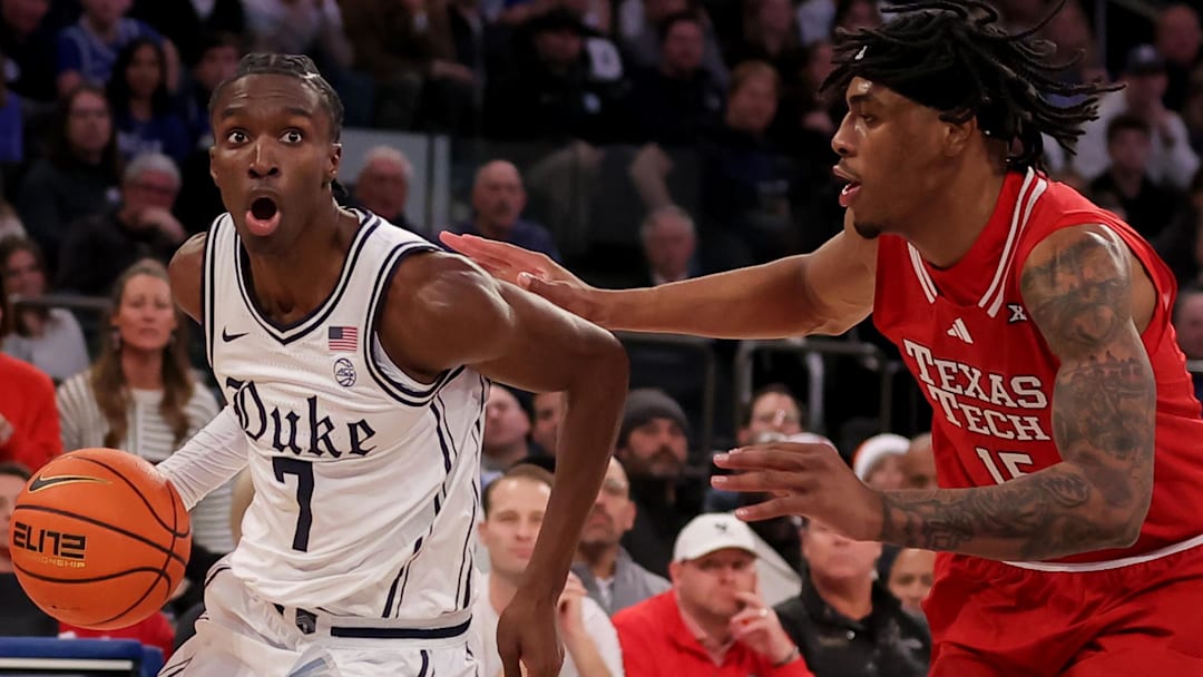 Dec 20, 2025; New York, New York, USA; Duke Blue Devils guard Dame Sarr (7) drives to the basket against Texas Tech Red Raiders forward JT Toppin (15) during the first half at Madison Square Garden. Mandatory Credit: Brad Penner-Imagn Images