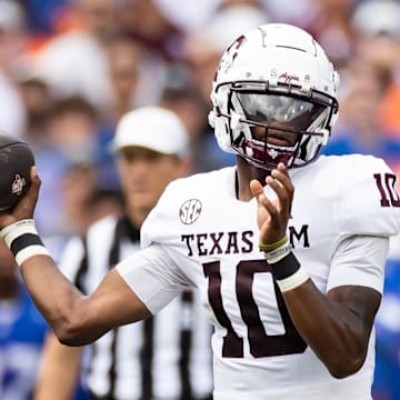 Sep 14, 2024; Gainesville, Florida, USA; Texas A&M Aggies quarterback Marcel Reed (10) throws the ball against the Florida Gators during the first half at Ben Hill Griffin Stadium.