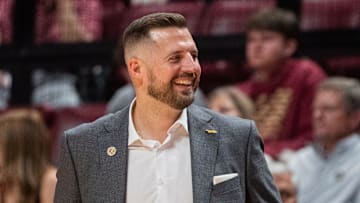 Florida State Seminoles head coach Luke Loucks smiles as his players celebrate. The Florida State Seminoles defeated the Alcorn State Braves 108-76 on Tuesday, Nov. 4, 2025.