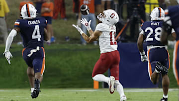 Sep 20, 2025; Charlottesville, Virginia, USA; Stanford Cardinal wide receiver Bryce Farrell (11) catches a touchdown pass as Virginia Cavaliers defensive back Christian Charles (4) and Cavaliers defensive back Donavon Platt (28) chase during the third quarter at Scott Stadium. Mandatory Credit: Geoff Burke-Imagn Images
